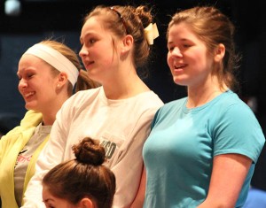 Council Mother Kaylynn Coulter, right, listens to directions during a notes session of a recent rehearsal for Hairspray.